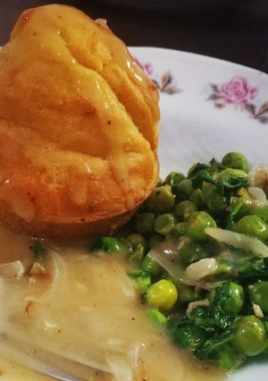 A picture of Buttermilk muffins, garlic peas and shallots in white sauce.