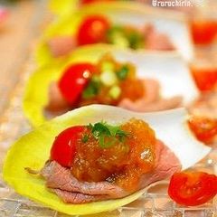 A picture of Beef on Endive with Ume Gelée Sauce.