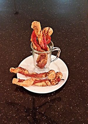 A picture of Bacon Wrapped Cheese Breadsticks.