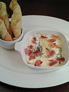 A picture of Shirred Eggs with Bacon and Cheese.