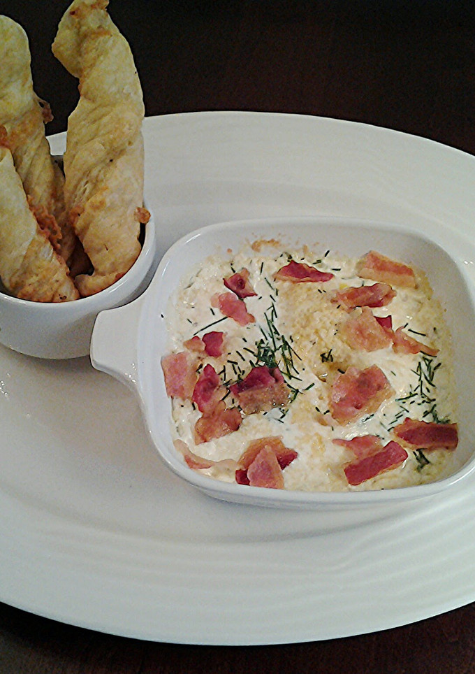 A picture of Shirred Eggs with Bacon and Cheese.