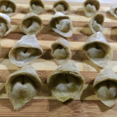 A picture of Home made Tortellini stuffed with Basil Pesto.