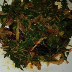 A picture of Smoked catfish in veggie sauce.