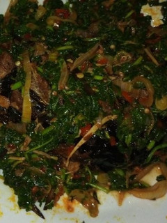 A picture of Smoked catfish in veggie sauce.