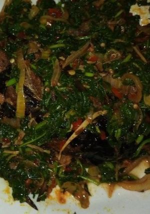 A picture of Smoked catfish in veggie sauce.