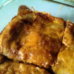 A picture of Cheese Enchiladas with Red Chile Sauce.