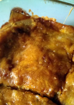 A picture of Cheese Enchiladas with Red Chile Sauce.