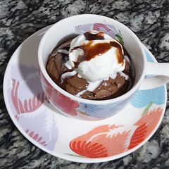 A picture of Nutella cup cake with vanilla icecream.