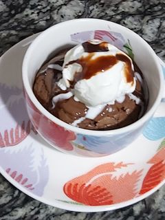 A picture of Nutella cup cake with vanilla icecream.