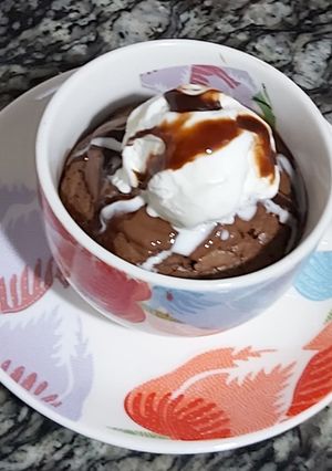 A picture of Nutella cup cake with vanilla icecream.