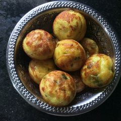 A picture of Kuzhi Paniyaram / Spicy Pan Cake.