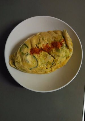A picture of Baked eggs with vegetables.