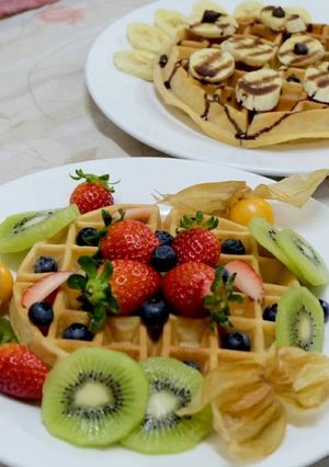 A picture of Waffles with Assorted Fruits.
