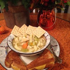 A picture of Chicken Noodle Soup With Grilled Cheese Jazzy Style.
