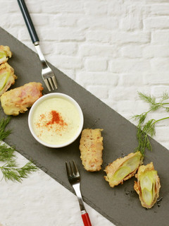 A picture of Beer-Battered Green Onion and Prosciutto Fritters.