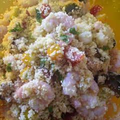 A picture of Colourful couscous salad with rainbow tomatoes lime & coriander.