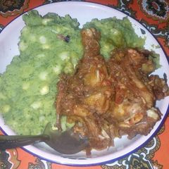 A picture of Matoke with Wet Fried Chicken.