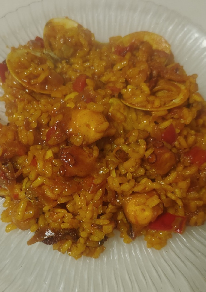 Una foto de Arroz con gambas, almejas y pulpo