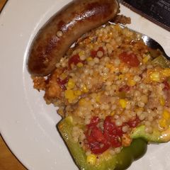 A picture of Couscous stuffed bell pepper.