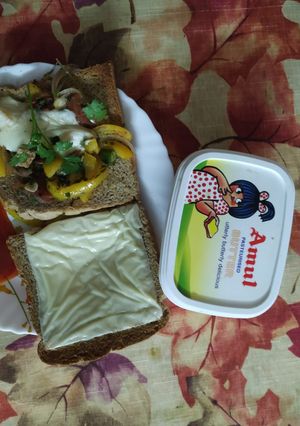 A picture of Open cheese, capsicum corn sandwich.