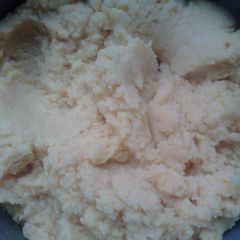 A picture of Jamaican turn corn meal and steamed fish head.