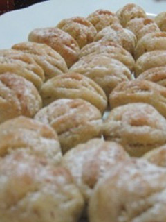 A picture of Walnut stuffed cookies - maamoul bi joz.