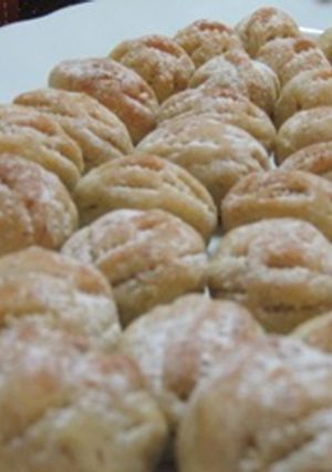 A picture of Walnut stuffed cookies - maamoul bi joz.