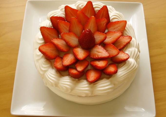 A Patissier's Cake Decorated With Lots of Strawberries