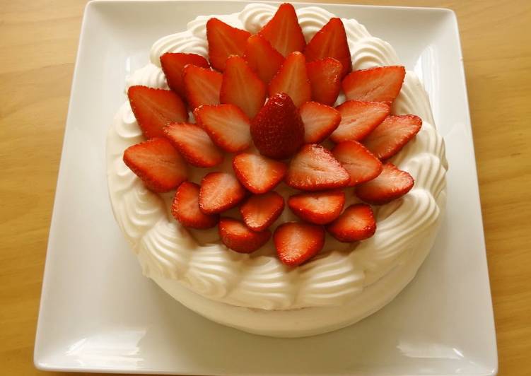 A Patissier's Cake Decorated With Lots of Strawberries