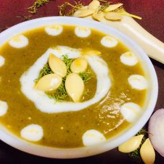 A picture of Pumpkin with dill leaves soup.