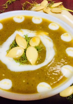 A picture of Pumpkin with dill leaves soup.