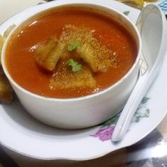 A picture of Tomato soup with Carrot and Potato.