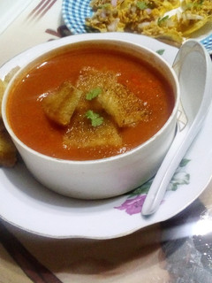 A picture of Tomato soup with Carrot and Potato.