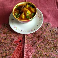 A picture of Kashmiri style apple and tomato curry.