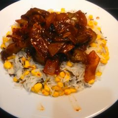 A picture of BBQ chicken with corn rice, for 2.