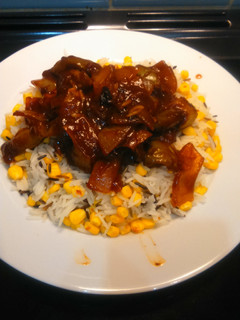 A picture of BBQ chicken with corn rice, for 2.