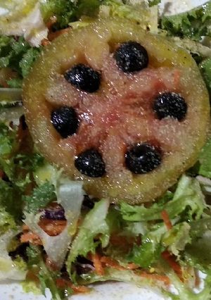 Una foto de Corona de escarola de tomate aceitunero