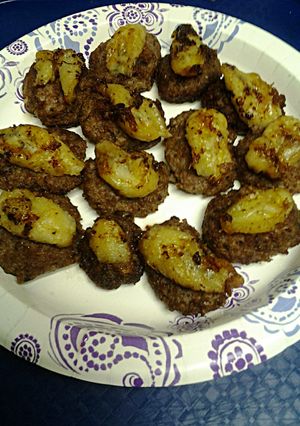 A picture of Fried Bananas Atop Sausage.