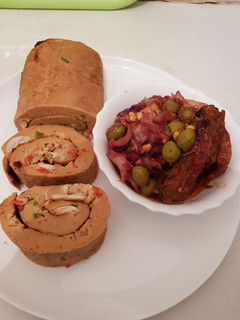 A picture of Moimoi Rolls with cabbage sauce.