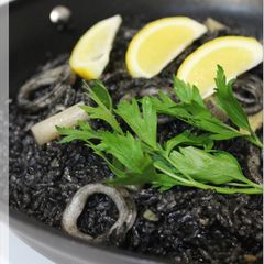 A picture of Paella with Squid and Squid Ink.
