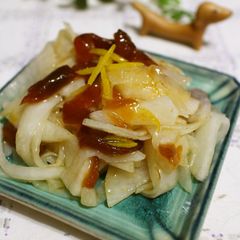 A picture of Yuzu Flavored Daikon Namasu Pickles with Dried Persimmon for Osechi.