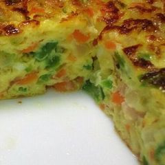 A picture of Omelette with Lots of Vegetables and Cheese.