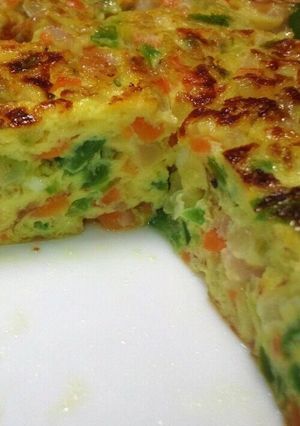 A picture of Omelette with Lots of Vegetables and Cheese.