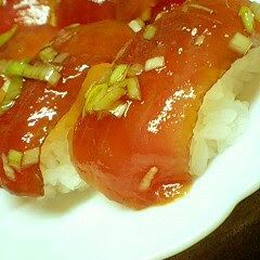A picture of Marinated Fresh Tuna Nigiri Sushi.