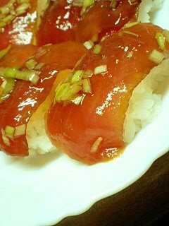 A picture of Marinated Fresh Tuna Nigiri Sushi.