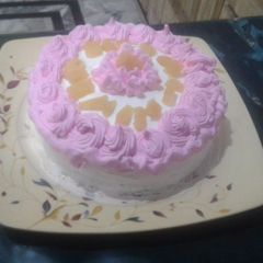 A picture of Cream cake pink white.