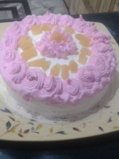 A picture of Cream cake pink white.