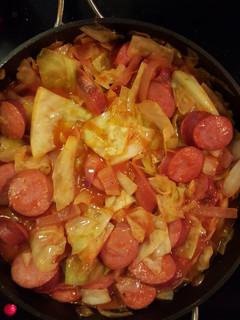 A picture of Cabbage and smoked sausage.