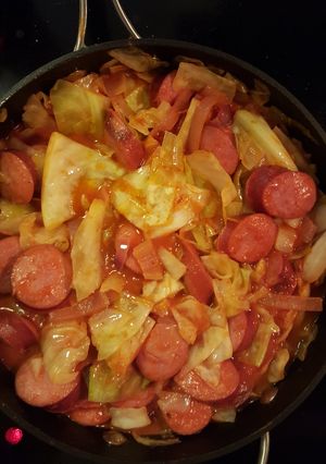 A picture of Cabbage and smoked sausage.