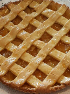 Una foto de Kuchen de durazno y manzanas